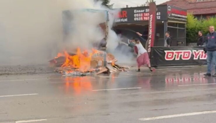 Alev alan kamyonete kadın kovayla müdahale etti.